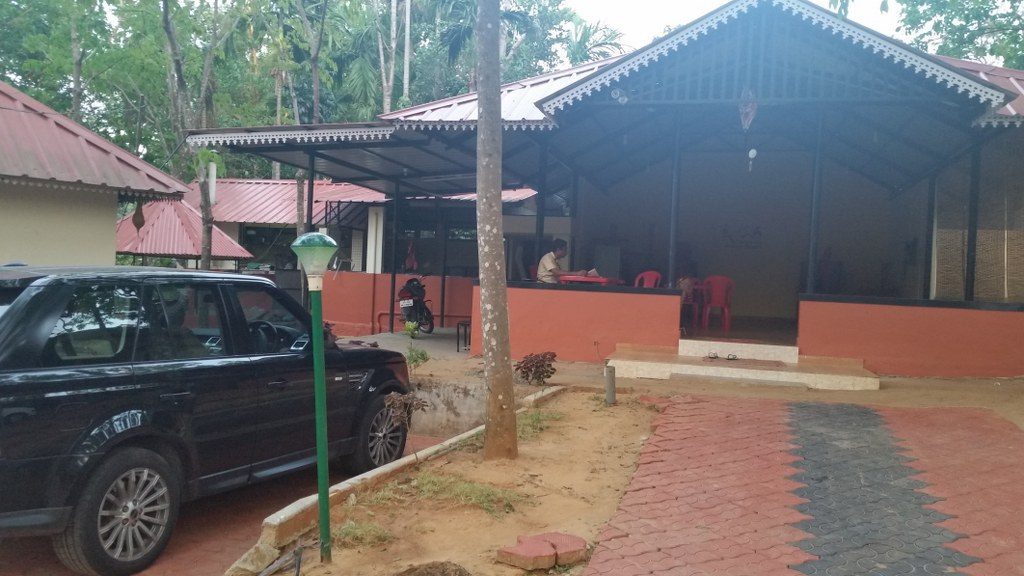 The dining area of Kandamath resorts . Shaji ettan sitting behind his desk